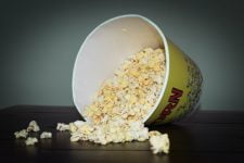 popcorn being poured from cup