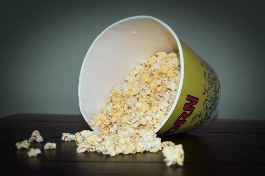 popcorn being poured from cup